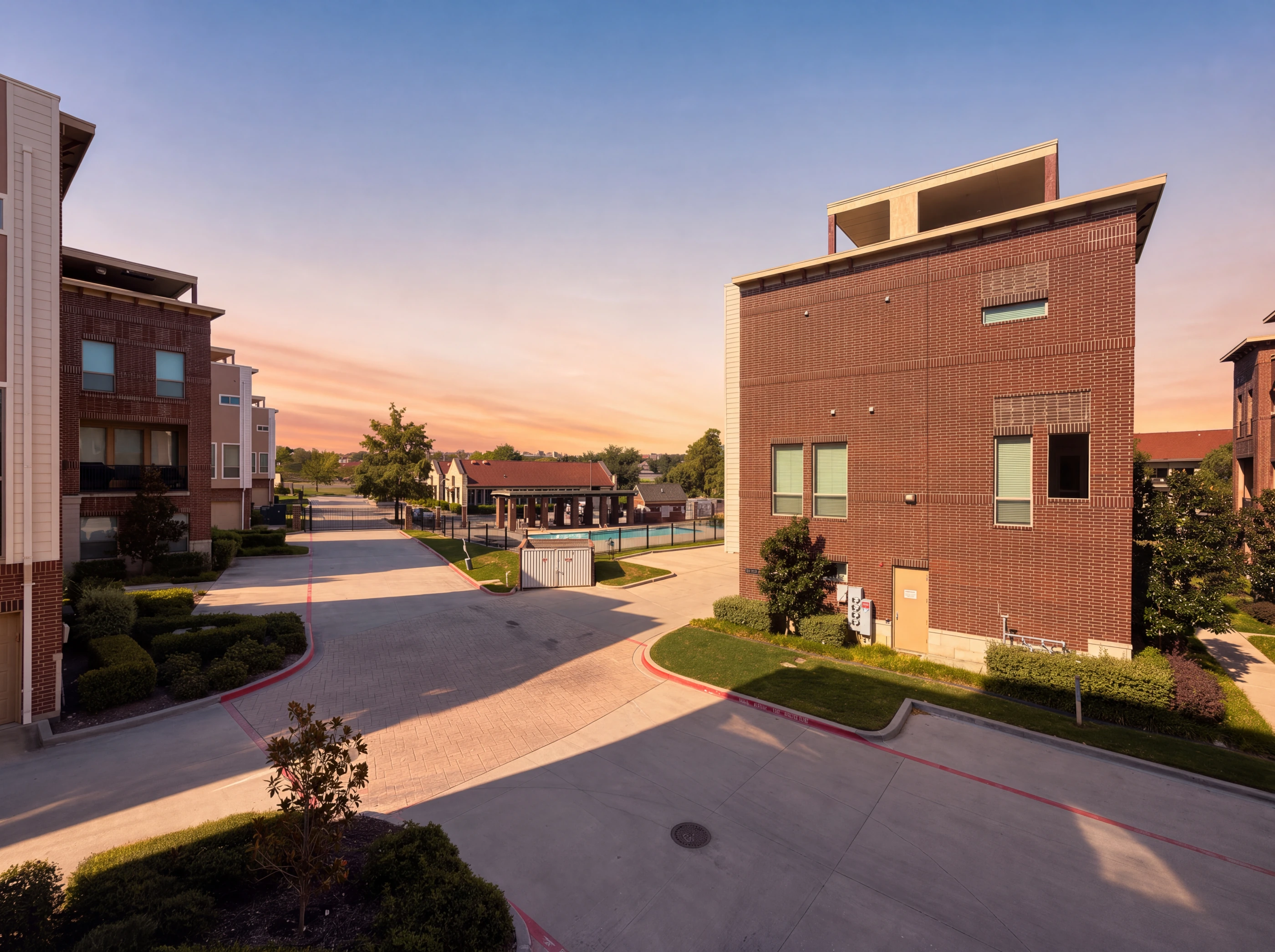 Community drive with the pool and cabana beyond